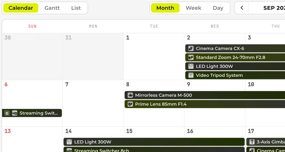 Month view of the booking calendar, with camera and light bookings drawn as bars across the days